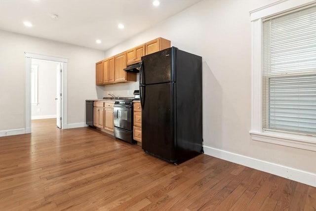 127-129 Franklin St, Malden, MA 02148 - kitchen featuring black appliances, baseboards, light wood finished floors, recessed lighting, and a sink