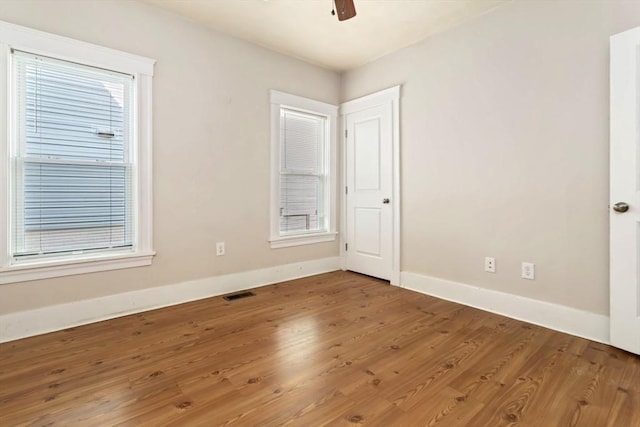 127-129 Franklin St, Malden, MA 02148 - unfurnished bedroom with baseboards, wood finished floors, and ceiling fan