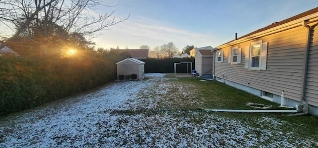 yard at dusk with a storage unit