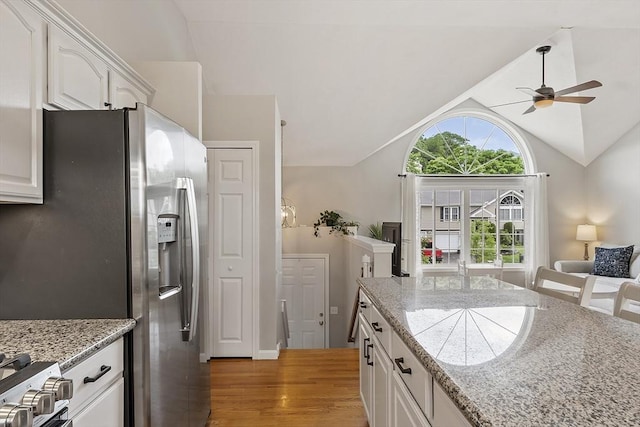 5 Holly Ter, Worcester, MA 01607 - kitchen featuring stainless steel fridge, ceiling fan, light wood finished floors, lofted ceiling, and white cabinets