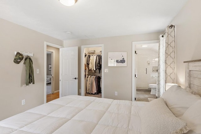 5 Holly Ter, Worcester, MA 01607 - bedroom featuring a walk in closet, a closet, and ensuite bathroom