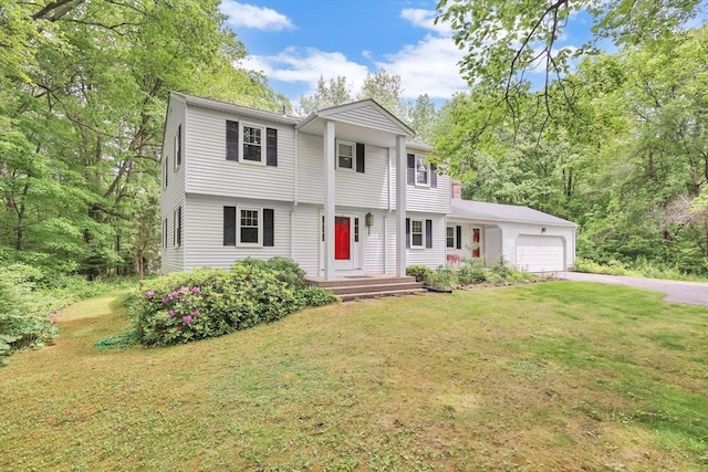 4 Mirick Ln, Wilbraham, MA 01095 - colonial home with a garage, asphalt driveway, and a front yard