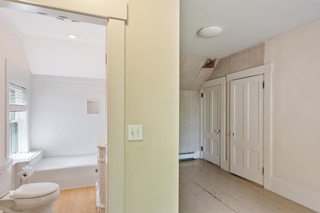267 Pearl Hill Rd, Fitchburg, MA 01420 - hall with a baseboard heating unit, light wood-style flooring, and lofted ceiling