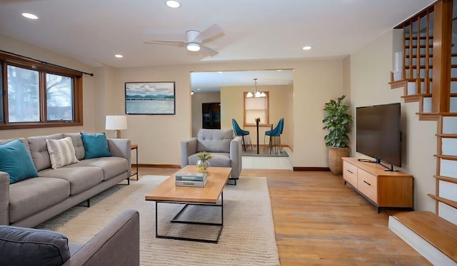 30 Royal St, Randolph, MA 02368 - living area featuring light wood finished floors, baseboards, a ceiling fan, recessed lighting, and stairs