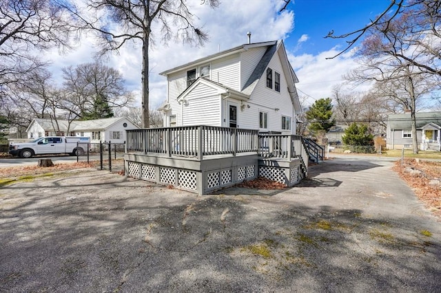 30 Royal St, Randolph, MA 02368 - view of side of property with a deck and fence