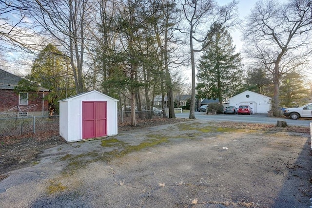 30 Royal St, Randolph, MA 02368 - view of yard with an outdoor structure, fence, a storage shed, and a detached garage