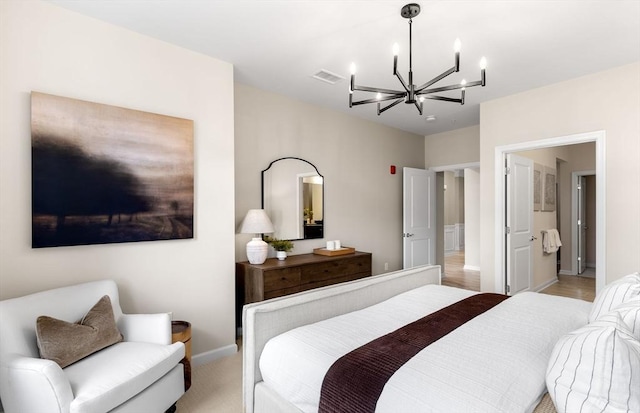 bedroom featuring visible vents, baseboards, and a notable chandelier