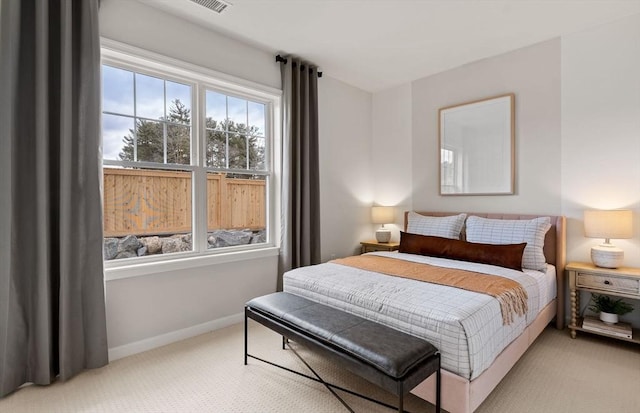 carpeted bedroom with baseboards