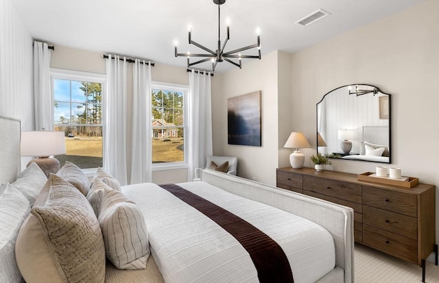 bedroom with light carpet, an inviting chandelier, and visible vents