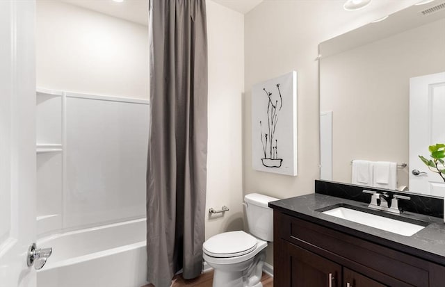 full bathroom featuring shower / bath combo, visible vents, toilet, and vanity