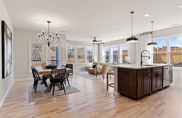 dining area featuring plenty of natural light and light wood-style flooring