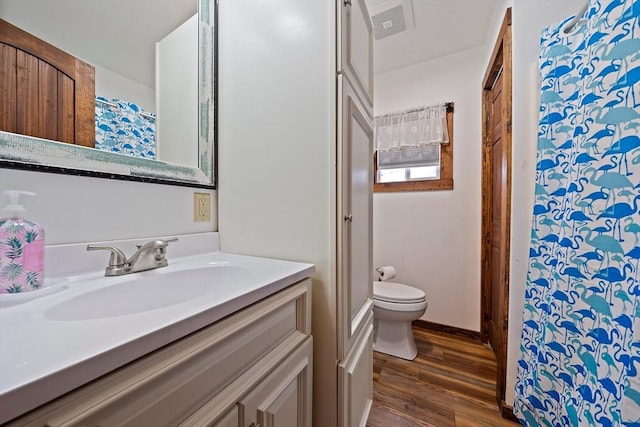 18 Marshfield Ave, Scituate, MA 02066 - full bathroom with toilet, wood finished floors, vanity, and a shower with curtain