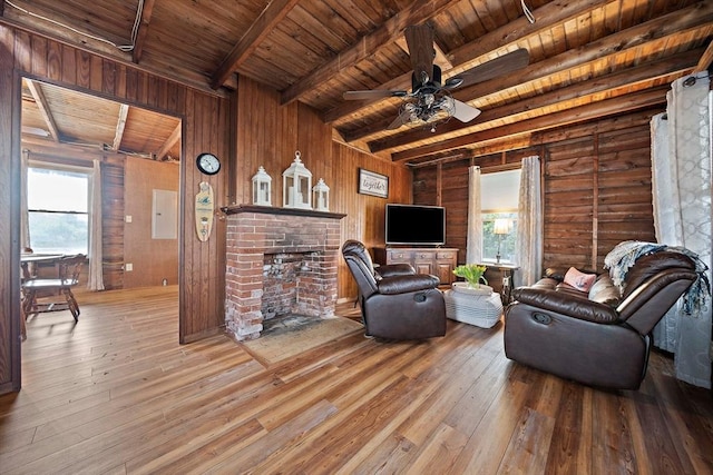18 Marshfield Ave, Scituate, MA 02066 - living area with wood ceiling, beamed ceiling, hardwood / wood-style flooring, ceiling fan, and a brick fireplace