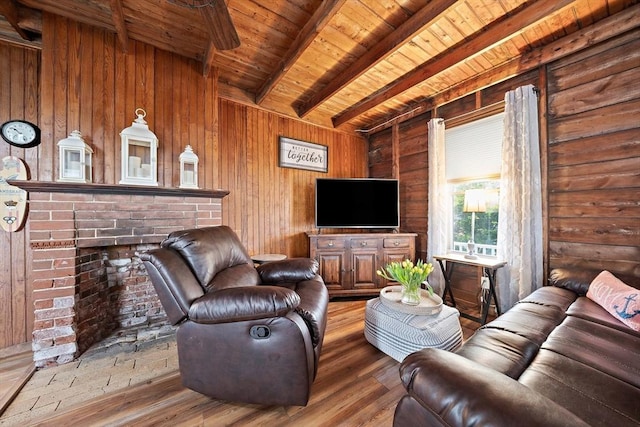 18 Marshfield Ave, Scituate, MA 02066 - living room with beam ceiling, wooden ceiling, hardwood / wood-style flooring, wooden walls, and a brick fireplace