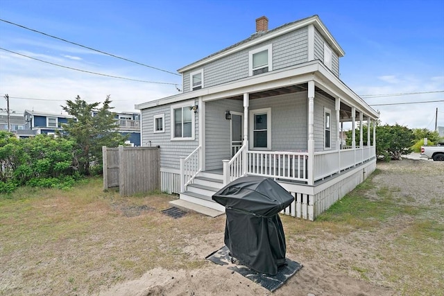 18 Marshfield Ave, Scituate, MA 02066 - view of front of house with covered porch and a chimney
