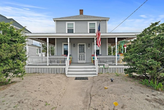 18 Marshfield Ave, Scituate, MA 02066 - country-style home with a chimney and covered porch