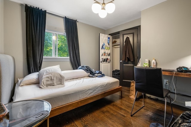 bedroom with hardwood / wood-style floors