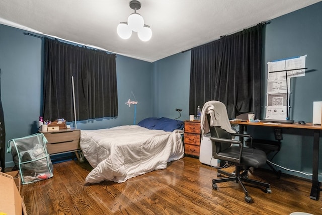 bedroom featuring hardwood / wood-style flooring