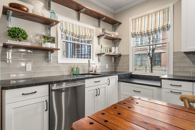 kitchen with white cabinets, stainless steel dishwasher, backsplash, open shelves, and crown molding