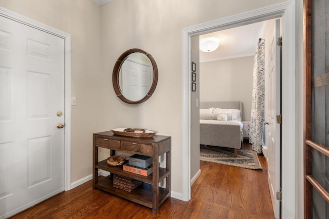 interior space featuring wood finished floors and baseboards