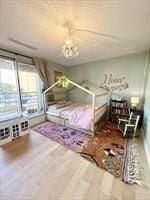 unfurnished bedroom with wood finished floors