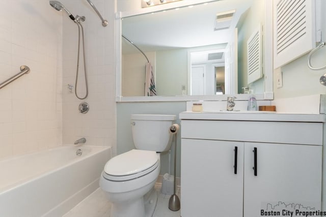 bathroom featuring toilet, vanity, shower / bath combo with shower curtain, and tile patterned floors