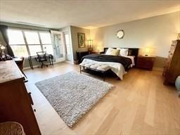 bedroom with wood finished floors