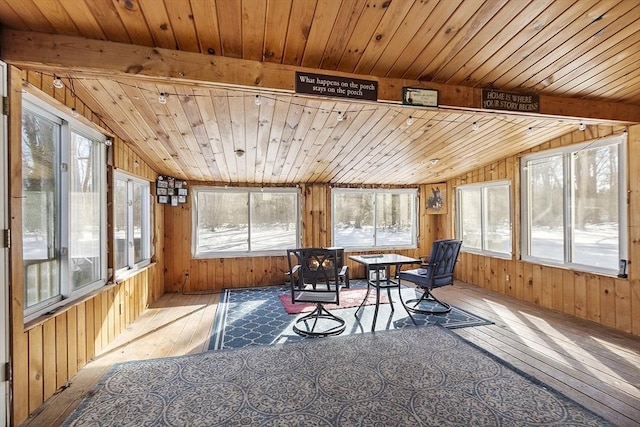 sunroom / solarium featuring vaulted ceiling and wooden ceiling