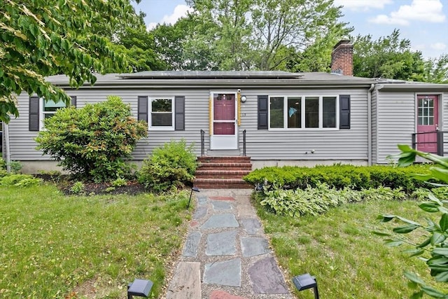 15 Leonard Rd, Sharon, MA 02067 - view of front of property with a chimney, roof mounted solar panels, and entry steps