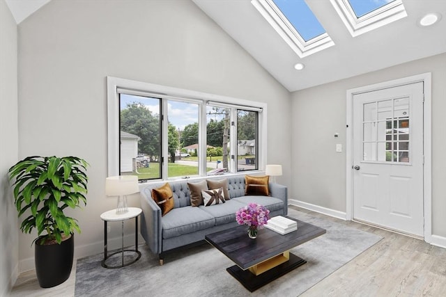 15 Leonard Rd, Sharon, MA 02067 - living area featuring a skylight, wood finished floors, high vaulted ceiling, and recessed lighting