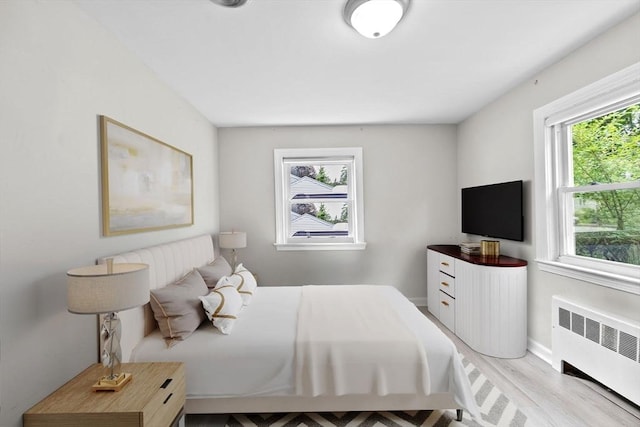 15 Leonard Rd, Sharon, MA 02067 - bedroom featuring radiator heating unit and wood finished floors