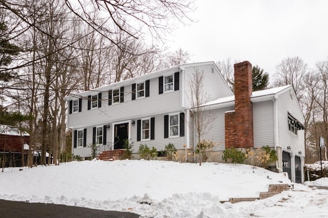 colonial inspired home featuring a garage