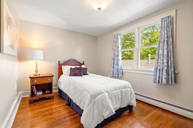 35 Commercial St Unit A, Marblehead, MA 01945 - bedroom featuring baseboard heating and wood finished floors