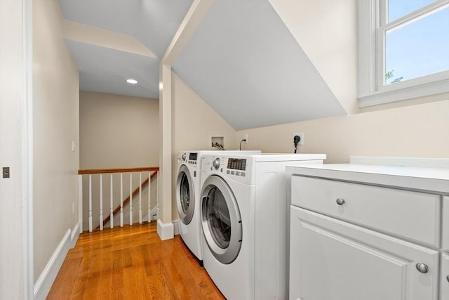 35 Commercial St Unit A, Marblehead, MA 01945 - washroom featuring light wood finished floors, washer and clothes dryer, cabinet space, and recessed lighting