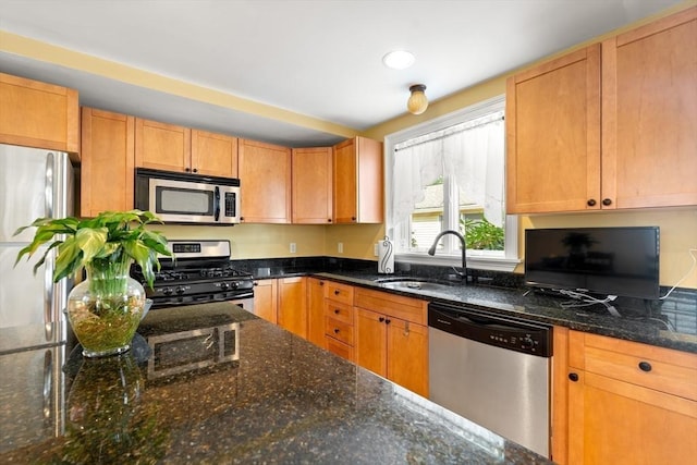 35 Commercial St Unit A, Marblehead, MA 01945 - kitchen with appliances with stainless steel finishes and dark stone countertops