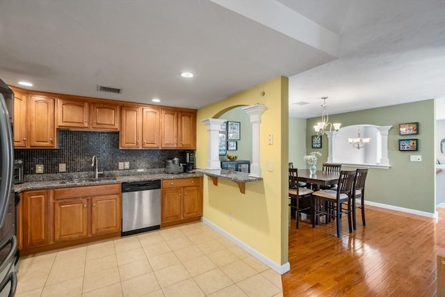 622 Hampton Way Unit 622, Abington, MA 02351 - kitchen featuring dishwasher, decorative columns, a sink, brown cabinetry, and recessed lighting