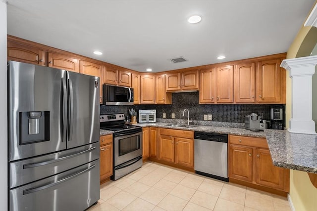 622 Hampton Way Unit 622, Abington, MA 02351 - kitchen featuring appliances with stainless steel finishes, a sink, dark stone counters, tasteful backsplash, and recessed lighting