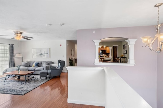 622 Hampton Way Unit 622, Abington, MA 02351 - living room with a chandelier, arched walkways, wood finished floors, a ceiling fan, and baseboards