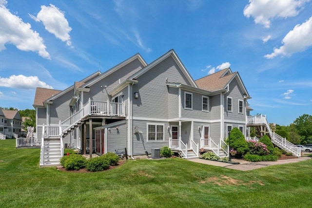 622 Hampton Way Unit 622, Abington, MA 02351 - rear view of property with stairs, a lawn, and central air condition unit