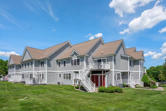 622 Hampton Way Unit 622, Abington, MA 02351 - back of property featuring stairway, a yard, central AC, and a deck