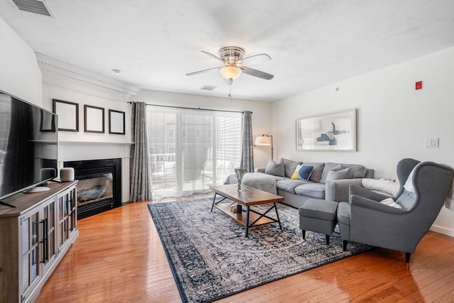 622 Hampton Way Unit 622, Abington, MA 02351 - living area featuring a ceiling fan, light wood-style floors, and a fireplace with flush hearth