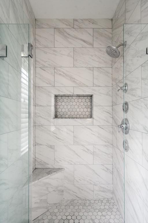 bathroom with a shower stall