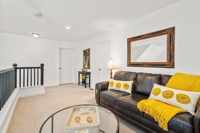 living room featuring recessed lighting, baseboards, and carpet