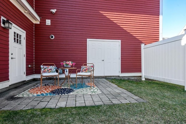 view of patio featuring fence