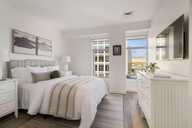 bedroom with wood finished floors