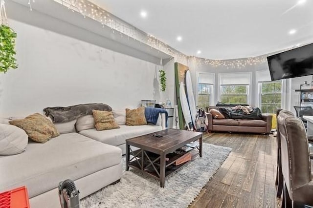 living room with hardwood / wood-style floors and recessed lighting