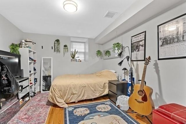 bedroom featuring wood finished floors