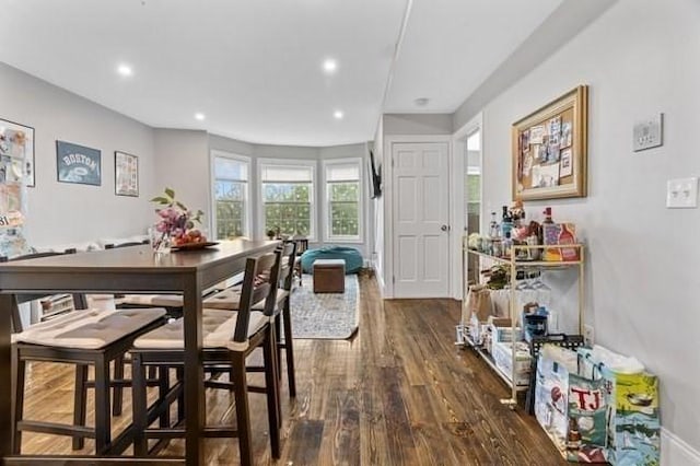 dining space featuring dark wood finished floors and recessed lighting