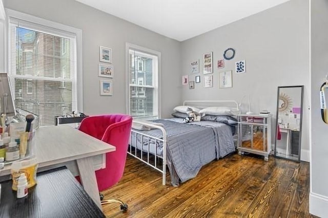 bedroom featuring wood finished floors