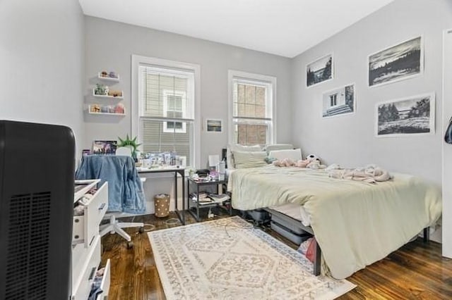bedroom featuring dark wood-style flooring